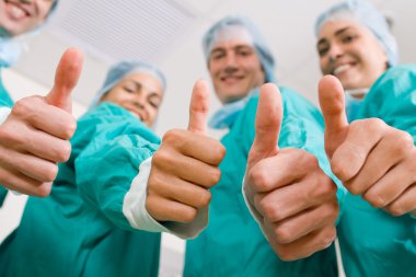 Group of medical doctors thumbs up clipart