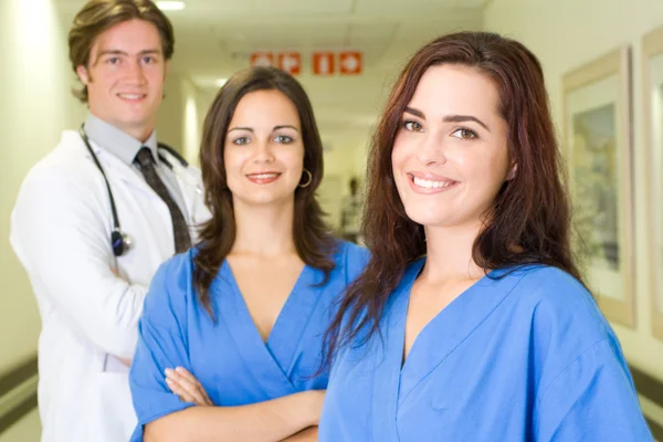 Group of young healthcare workers portrait in hospital — Stock Photo, Image