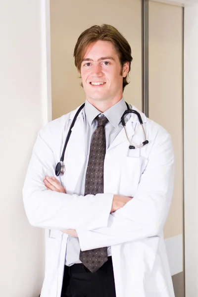 Happy handsome male doctor in hospital — Stock Photo, Image