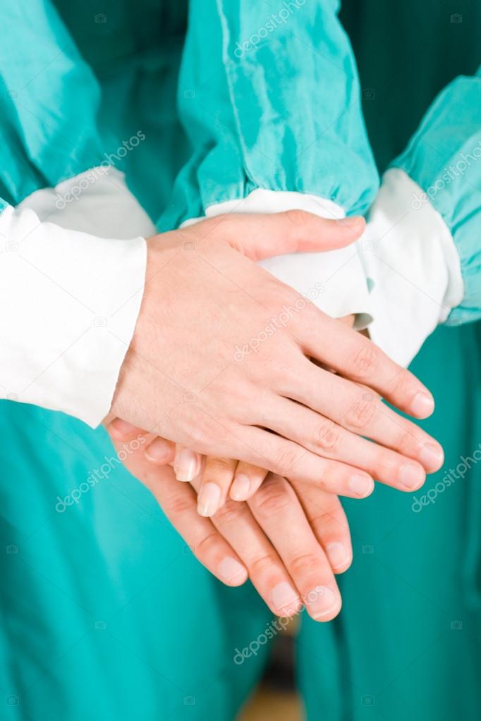 Group of medical doctors hands together