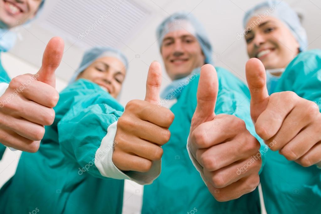 Group of medical doctors thumbs up — Stock Photo © michaeljung 12037283
