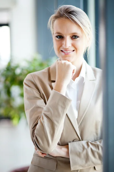 Attractive young businesswoman portrait by window — Zdjęcie stockowe