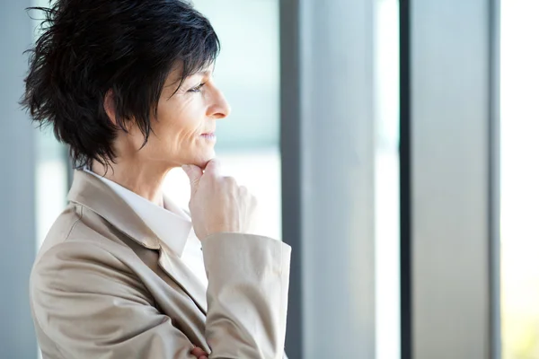 Thoughtful middle aged businesswoman closeup portrait — Stock Photo, Image