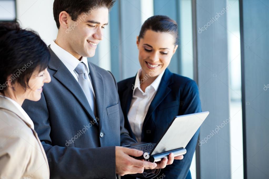 Group of business using laptop