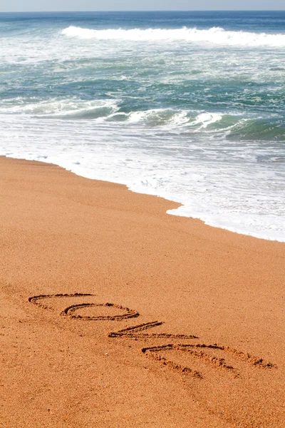 A palavra escrita na praia — Fotografia de Stock