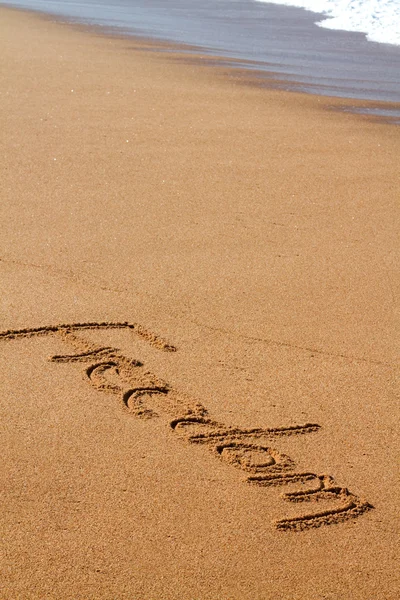 La palabra escrita en la playa — Foto de Stock