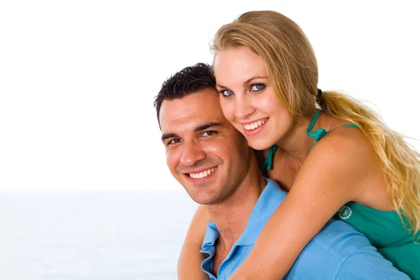 Happy young couple piggyback — Stock Photo, Image