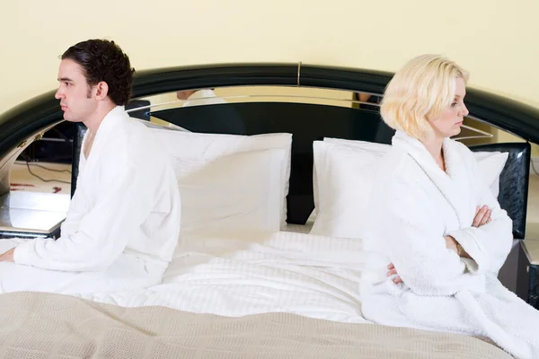 Unhappy couple in bedroom — Stock Photo, Image