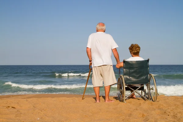 Senior man with his disabled wife — Stock Photo, Image