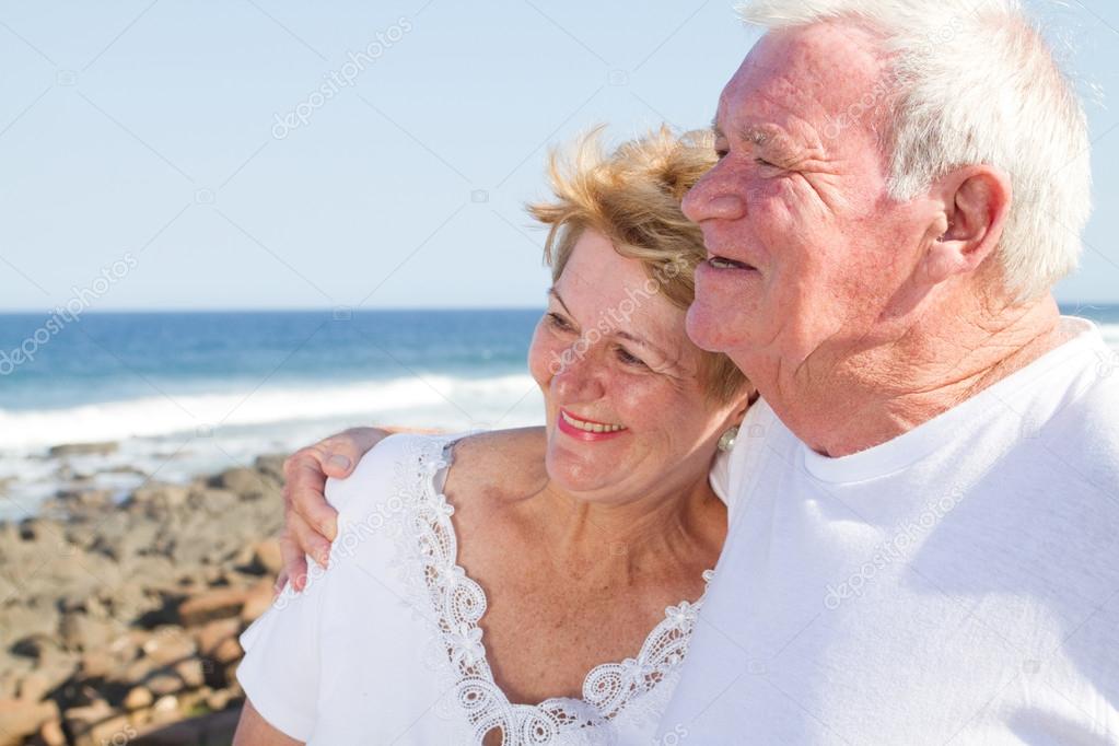 Happy senior citizen couple hugging