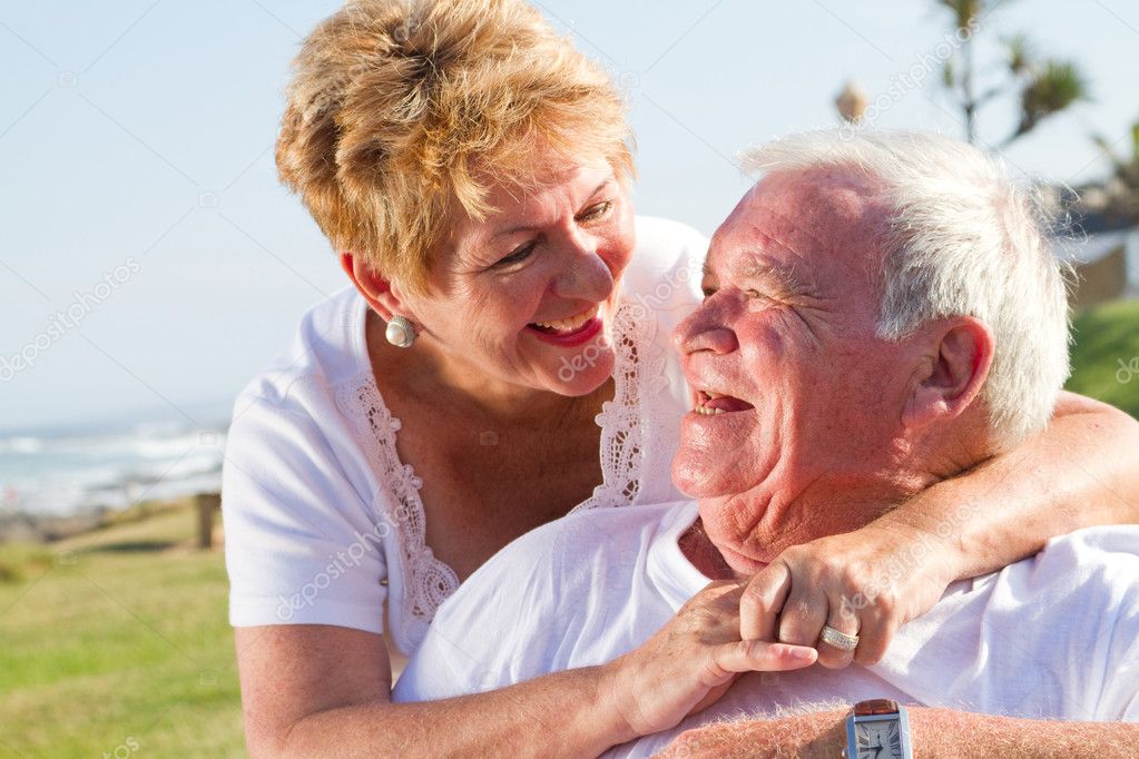 Happy laughing senior couple