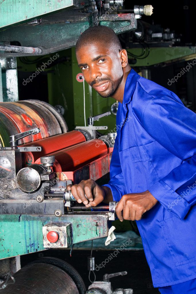 African printing machine operator at work ⬇ Stock Photo, Image by