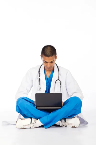 Male Indian medical intern working on computer — Stock Photo, Image