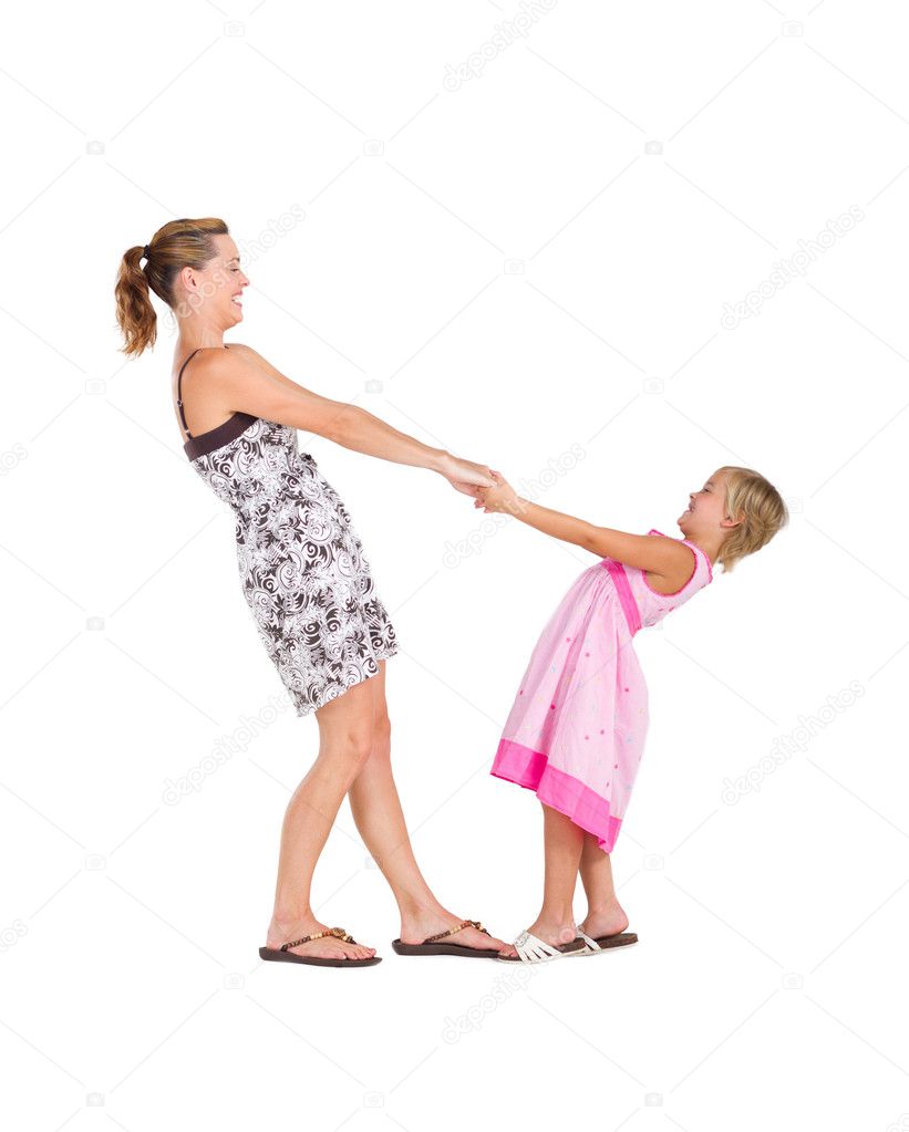 Happy mother and daughter dance on white background