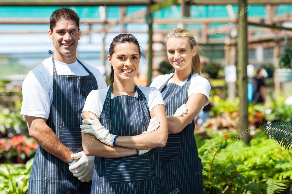 Group of florists portrait in greenhouse Stock Photo by ©michaeljung