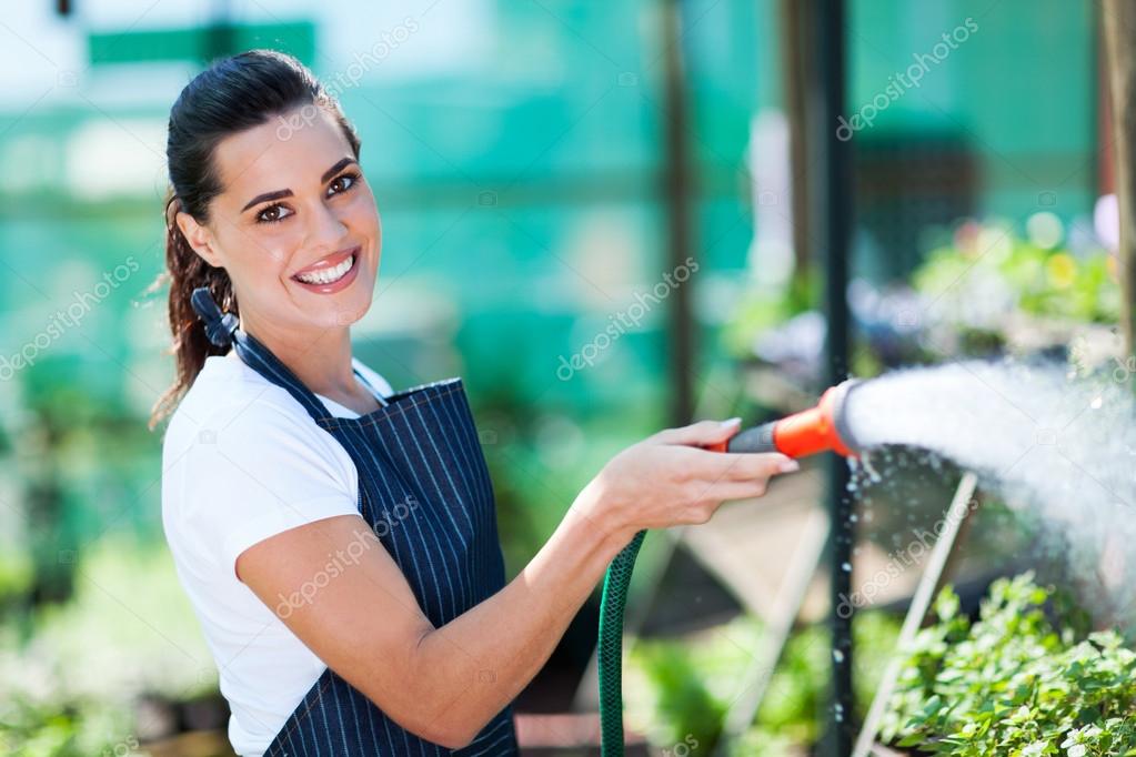 http://st.depositphotos.com/1011643/1489/i/950/depositphotos_14899861-Pretty-florist-watering-flowers-in-greenhouse.jpg