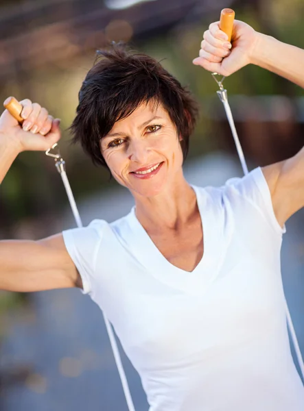 Active middle aged woman with jumping rope — Stock Photo, Image
