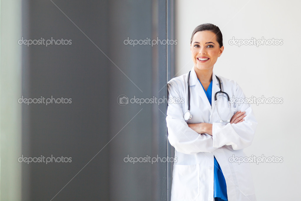 Attractive young female medical doctor portrait in office
