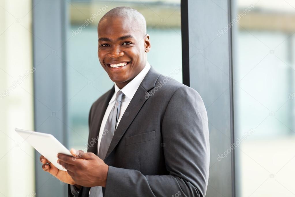 Male african american office worker with tablet computer Stock Photo by  ©michaeljung 14964165