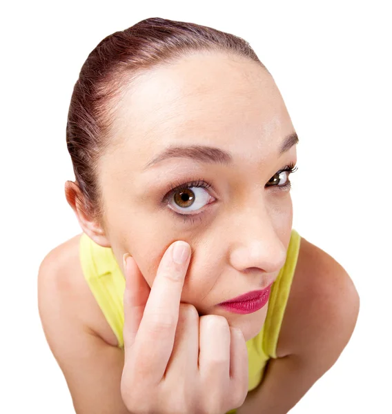 Young woman looking into a mirror and checking her eyeball — Stock Photo, Image