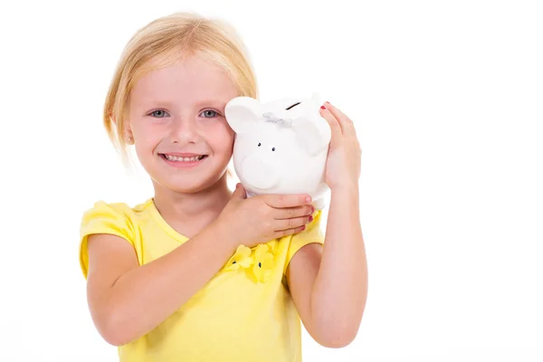 Cute little girl carrying piggybank on her shoulder — Zdjęcie stockowe