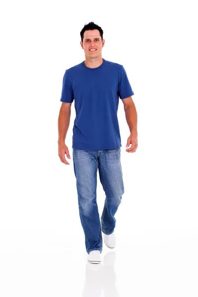 Casual young man walking on white — Stock Photo, Image