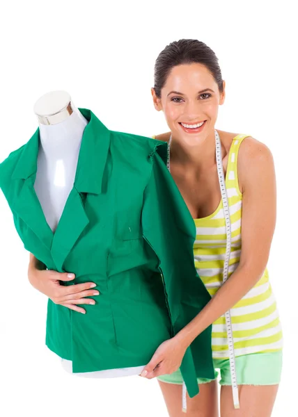 Happy young dressmaker holding mannequin on white — Stock Photo, Image