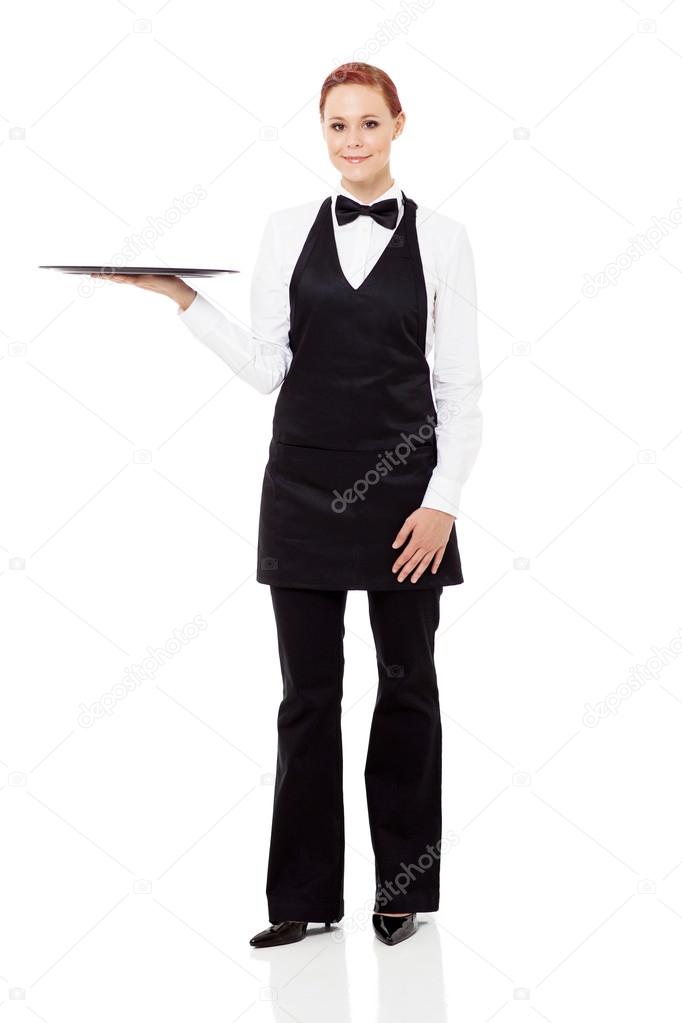 Young waitress holding a empty tray isolated on white