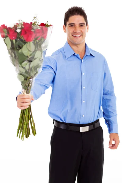 Romantic young man giving bunch of roses isolated on white — Stock Photo, Image