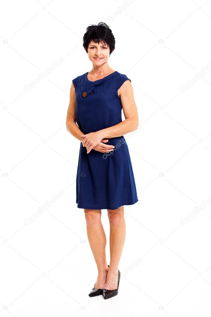 Elegant middle aged woman in blue dress full length portrait isolated on white