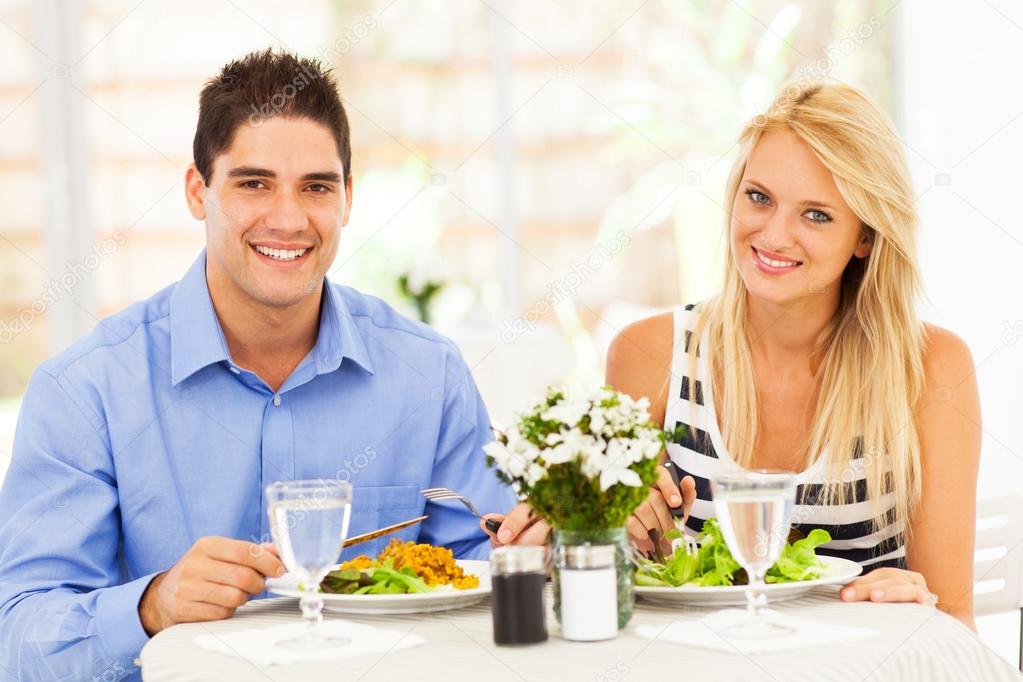 Young couple having lunch in restaurant