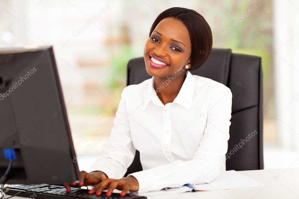 Young african american businesswoman working on computer
