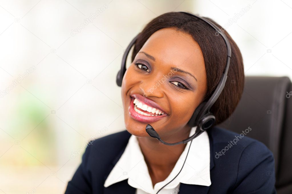 Happy african american call center operator with headphones