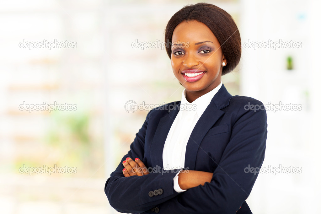 Pretty african american businesswoman half length portrait in office
