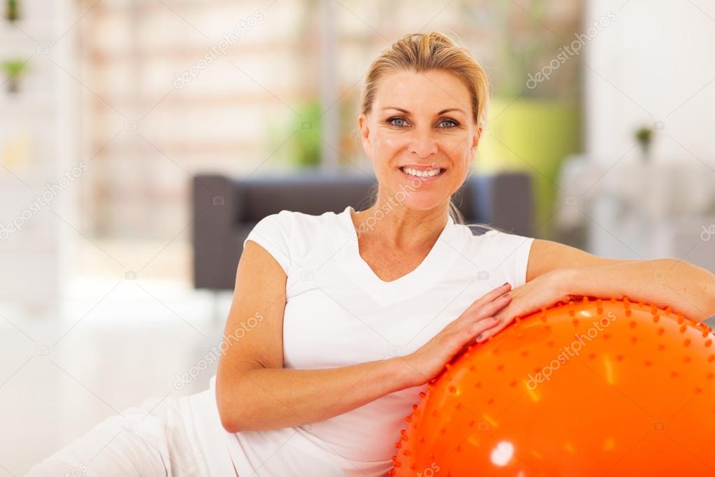 Healthy senior woman portrait with exercise ball
