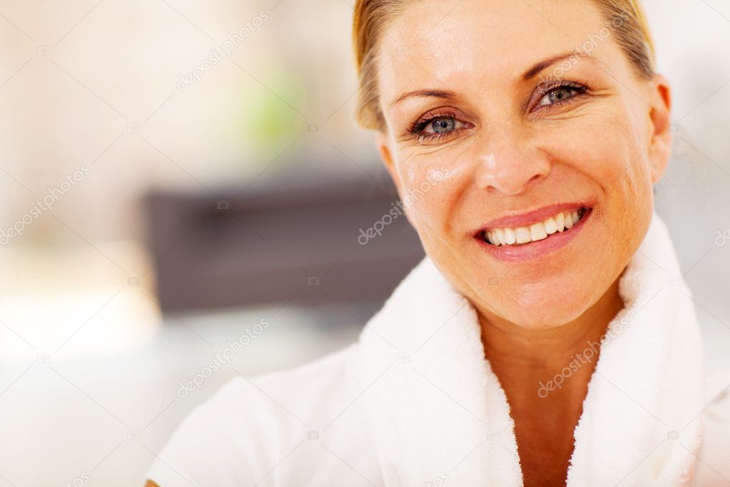 Fit middle aged woman closeup portrait with towel on her neck