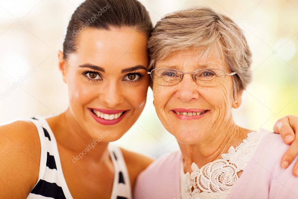Happy woman and senior mother closeup portrait