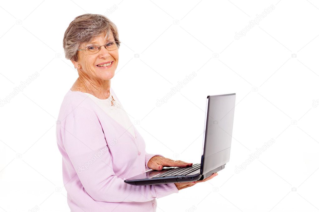 Elderly woman with laptop computer isolated on white