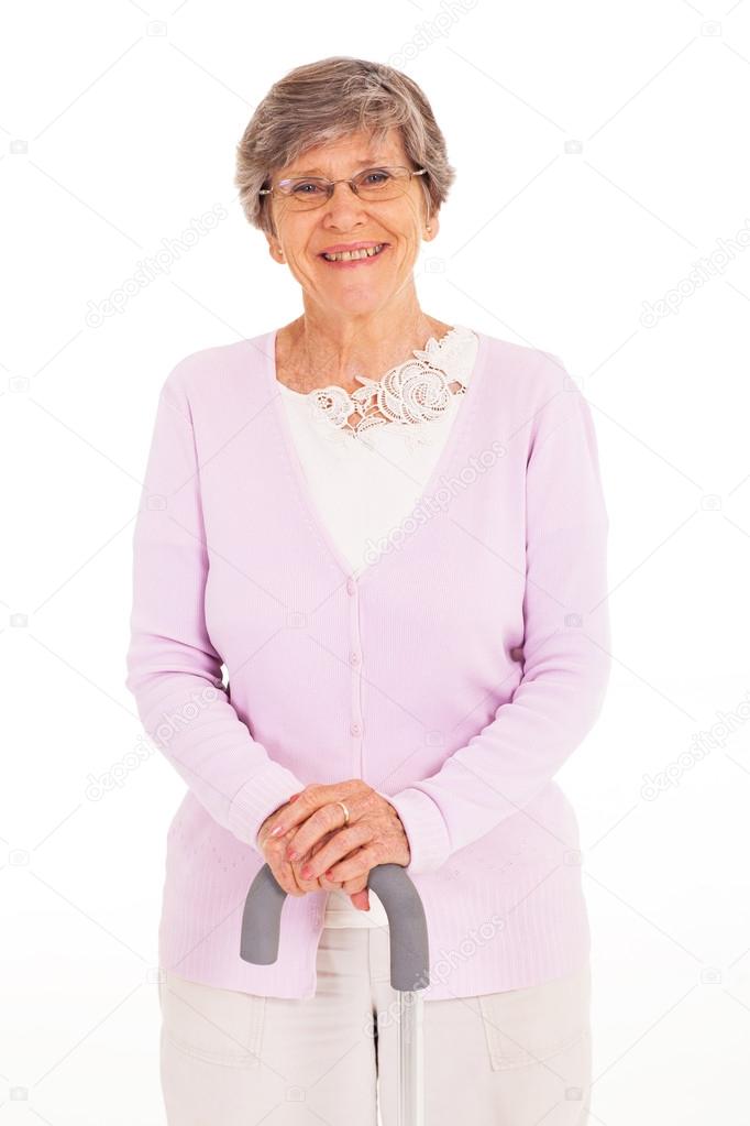 Happy elderly lady with walking cane isolated on white