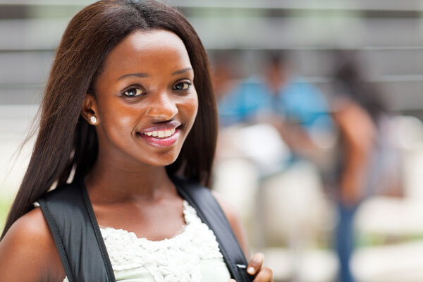 pretty female african american high school student on campus