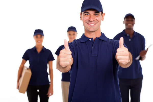 IT technician giving two thumbs up in front of colleagues