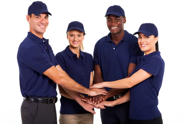 Service-team handen samen op witte achtergrond — Stockfoto