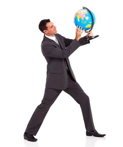 Jeune homme d'affaires tenant un globe isolé sur blanc — Photo