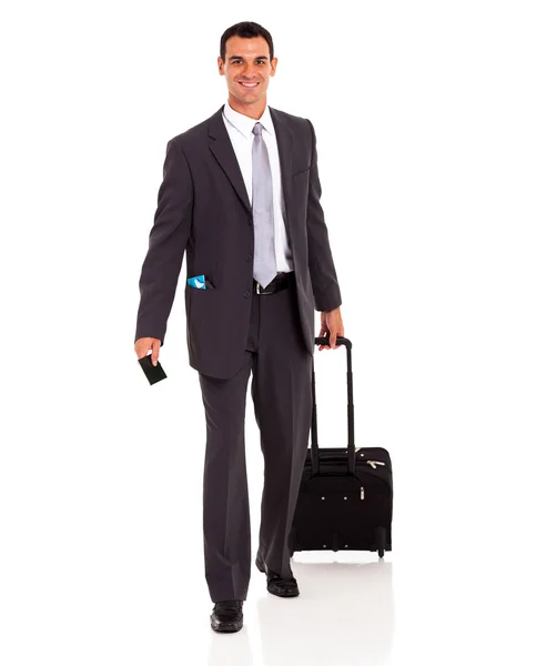 Businessman walking with trolley bag and passport — Stock Photo, Image