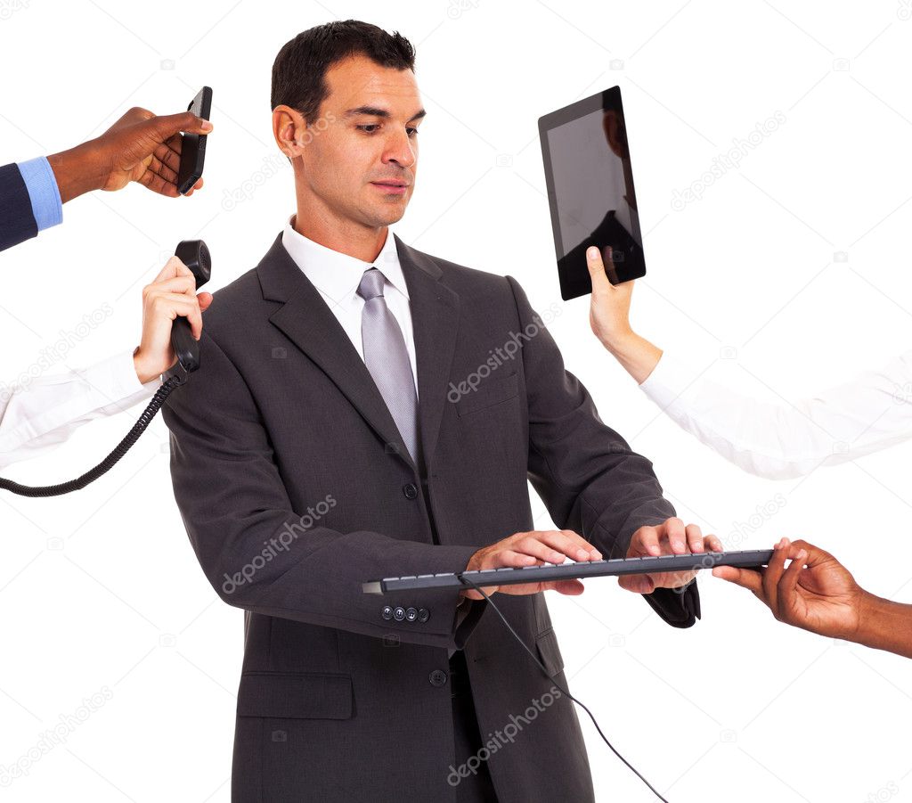 busy businessman working with multiple gadgets isolated on white