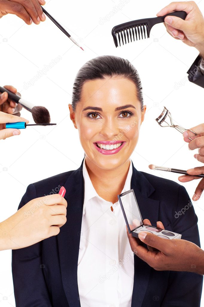 pretty businesswoman with makeup tools around her