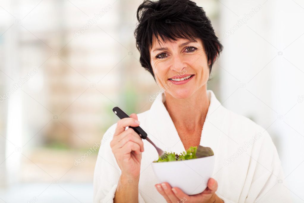 Woman eating salad