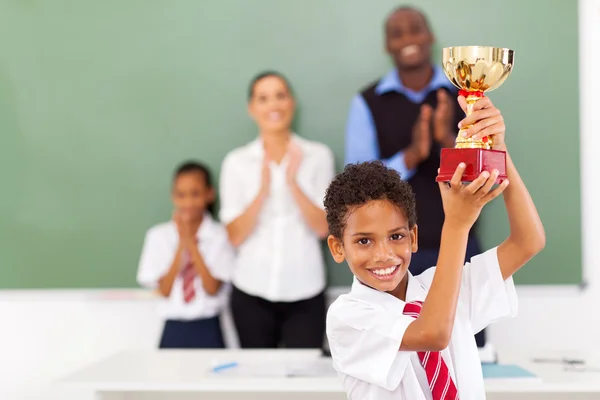 Elementary school student holding a trophy — Stock Photo, Image