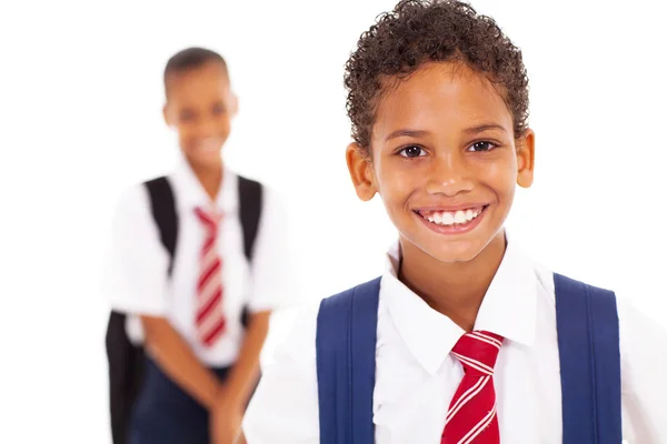 Carino scolaro elementare di fronte al compagno di classe — Foto Stock