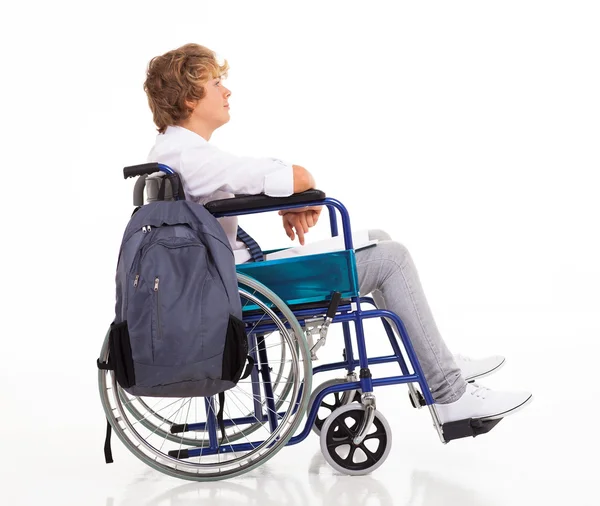 Postižené teen chlapec sedící na vozíku — Stock fotografie